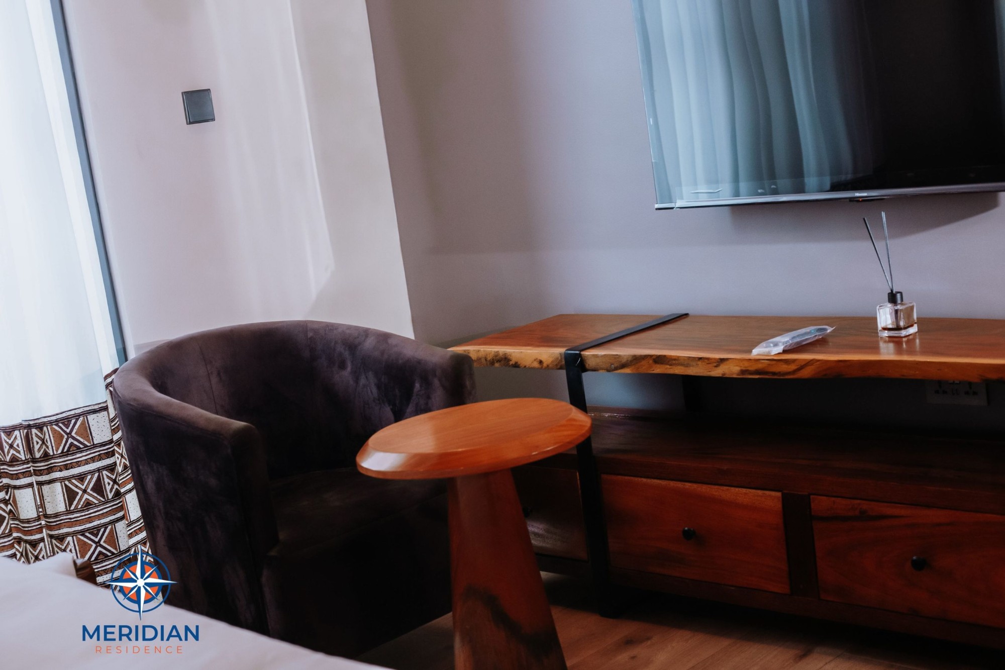 Quiet in-room workspace for a consultant on a long stay at Meridian Residence, Tema