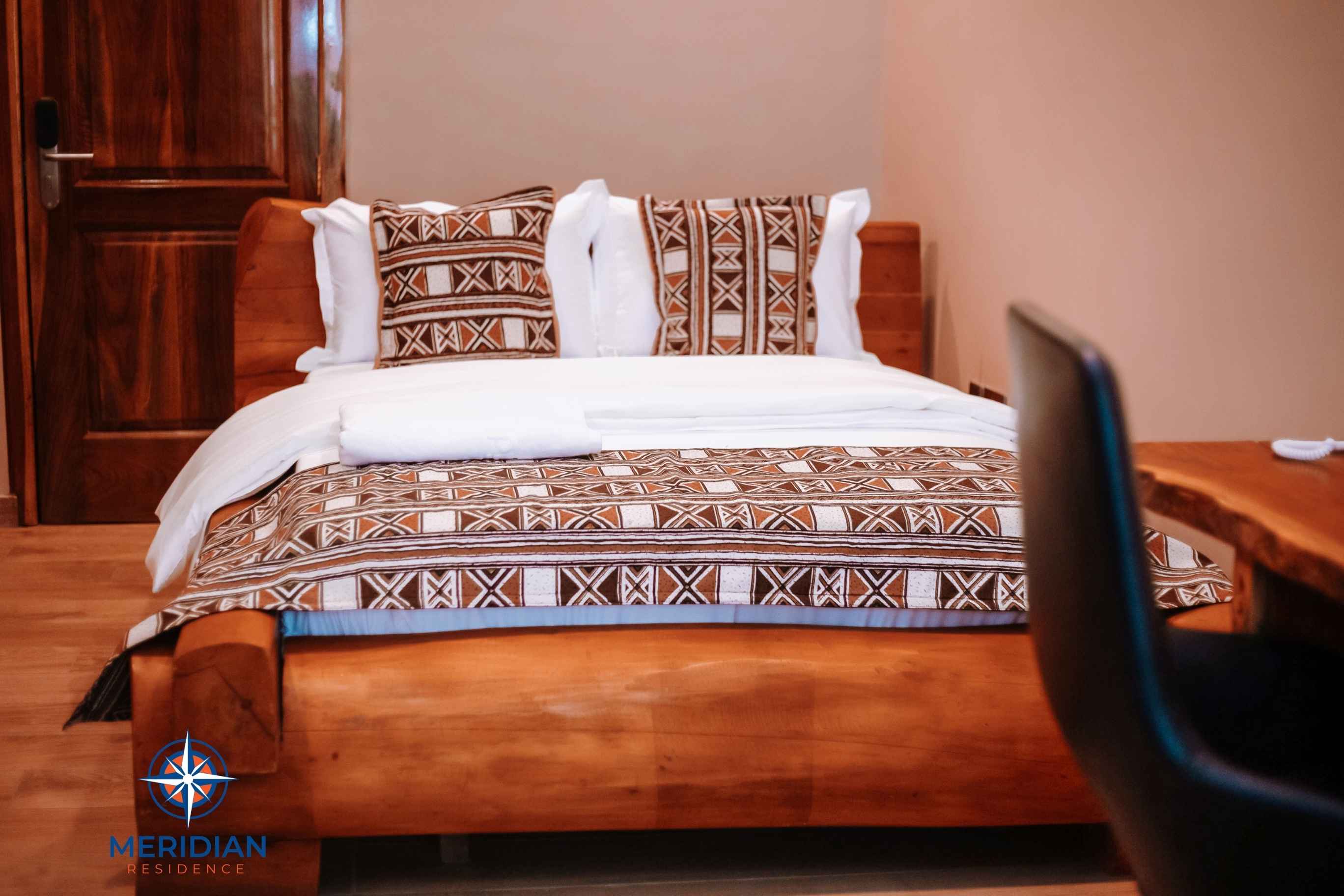 Standard hotel room with double bed at Meridian Residence, Tema